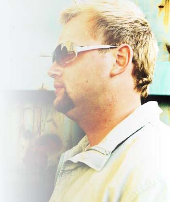 Andreas Wennersköld (WennE) Portrait of Andreas Wennersköld (WennE) in sunglasses, seen in profile against a bright background.